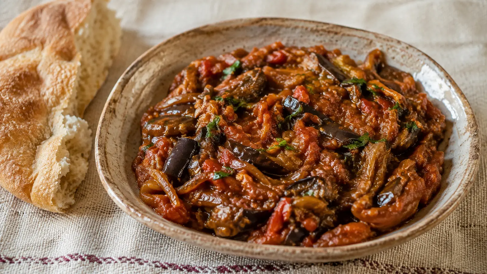 Moroccan zaalouk eggplant and tomato salad served with bread