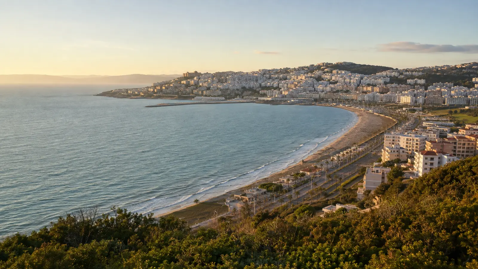 Tangier bay and white hillside buildings in warm evening light
