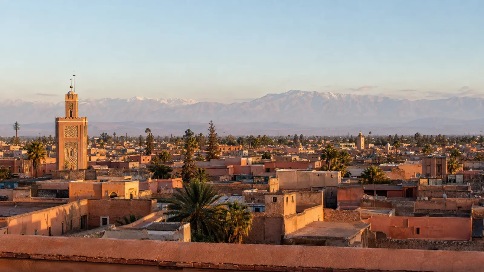 Ochre Marrakech rooftops with the Atlas Mountains in the distance