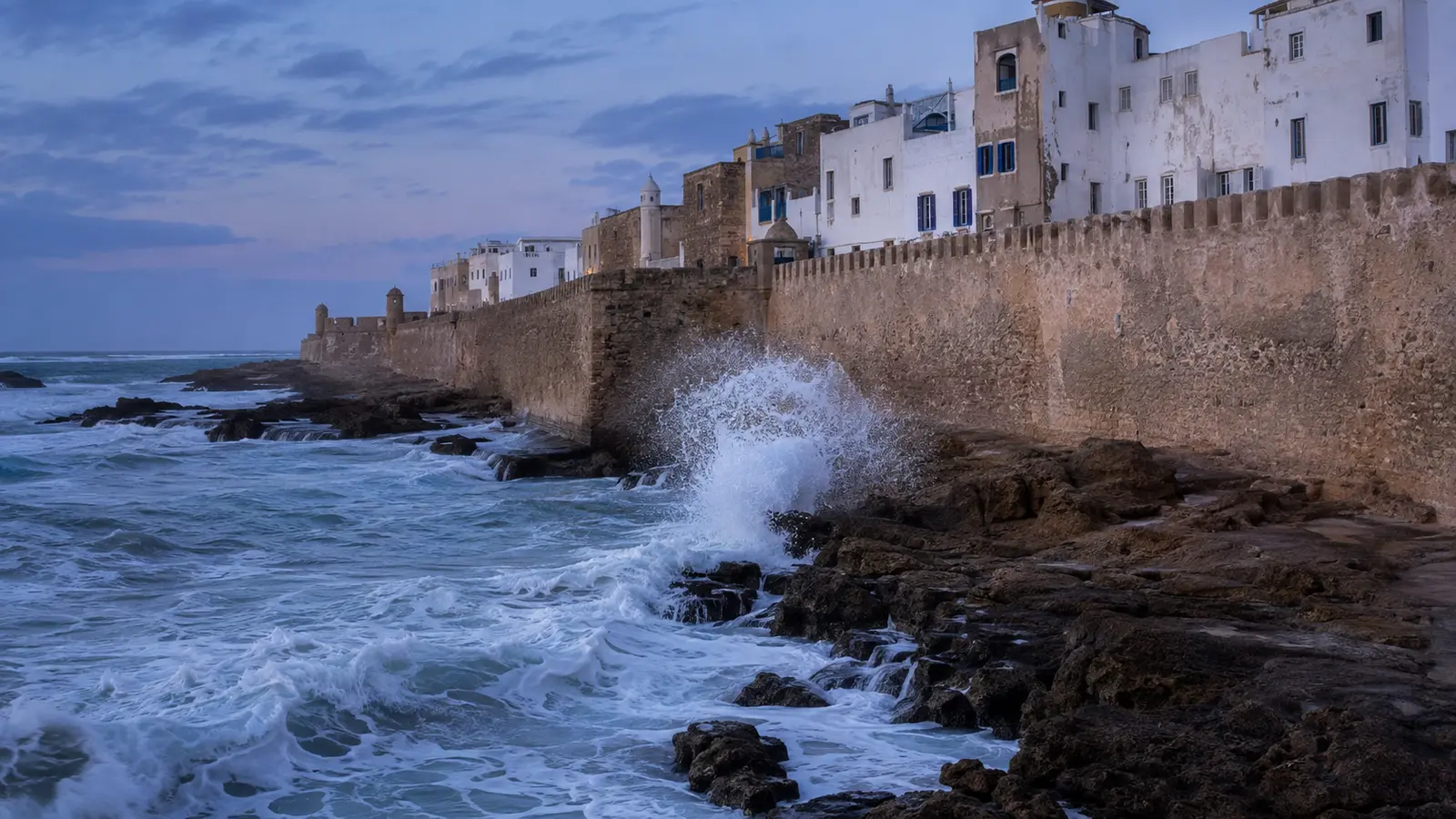 Essaouira ramparts above Atlantic surf in evening light