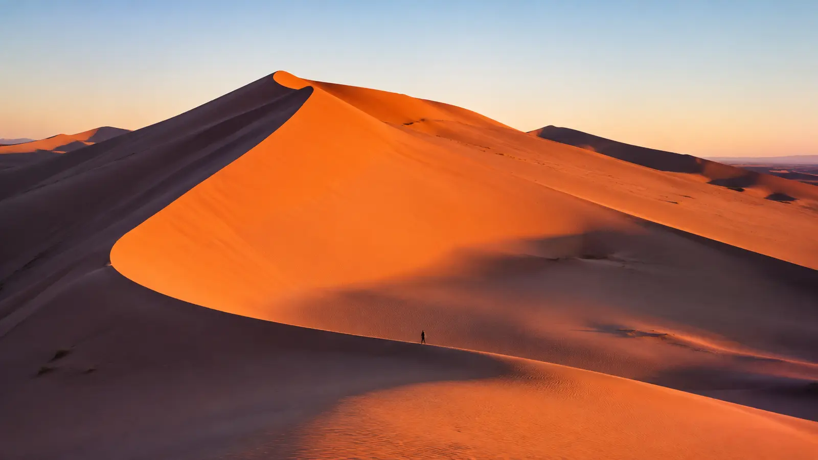 Sunrise over an undisturbed Erg Chebbi dune ridge near Merzouga
